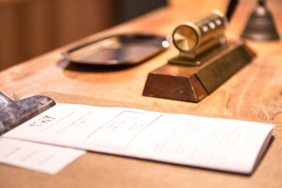 A desk with legal documents and a magnifying glass